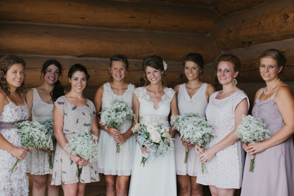 Bride and bridesmaids group portrait with rustic charm - wedding photo by Michigan-based wedding photographers Bryan and Mae